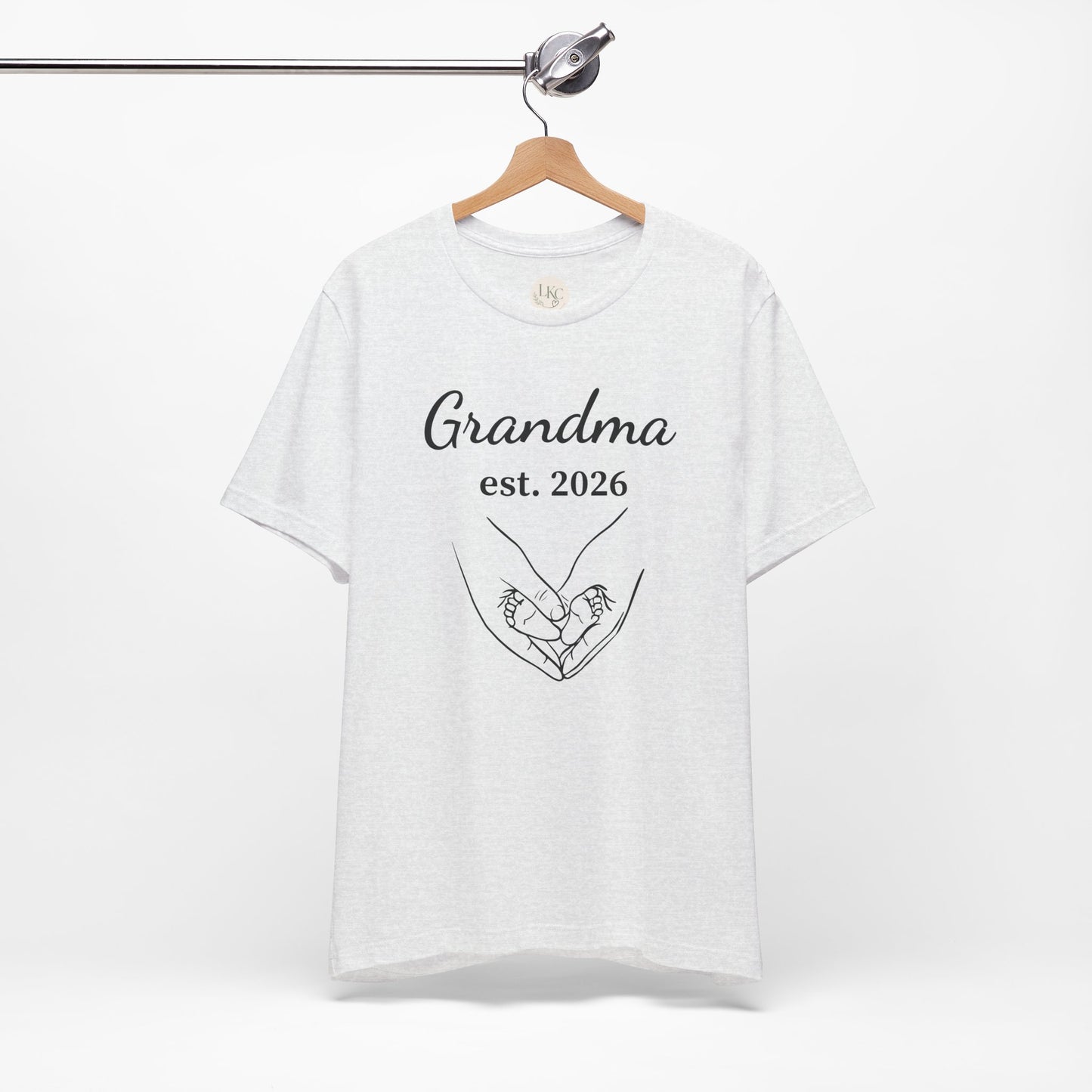 Grandma Est. 2026 T-Shirt — New Grandma Announcement Tee with Handholding Baby Illustration