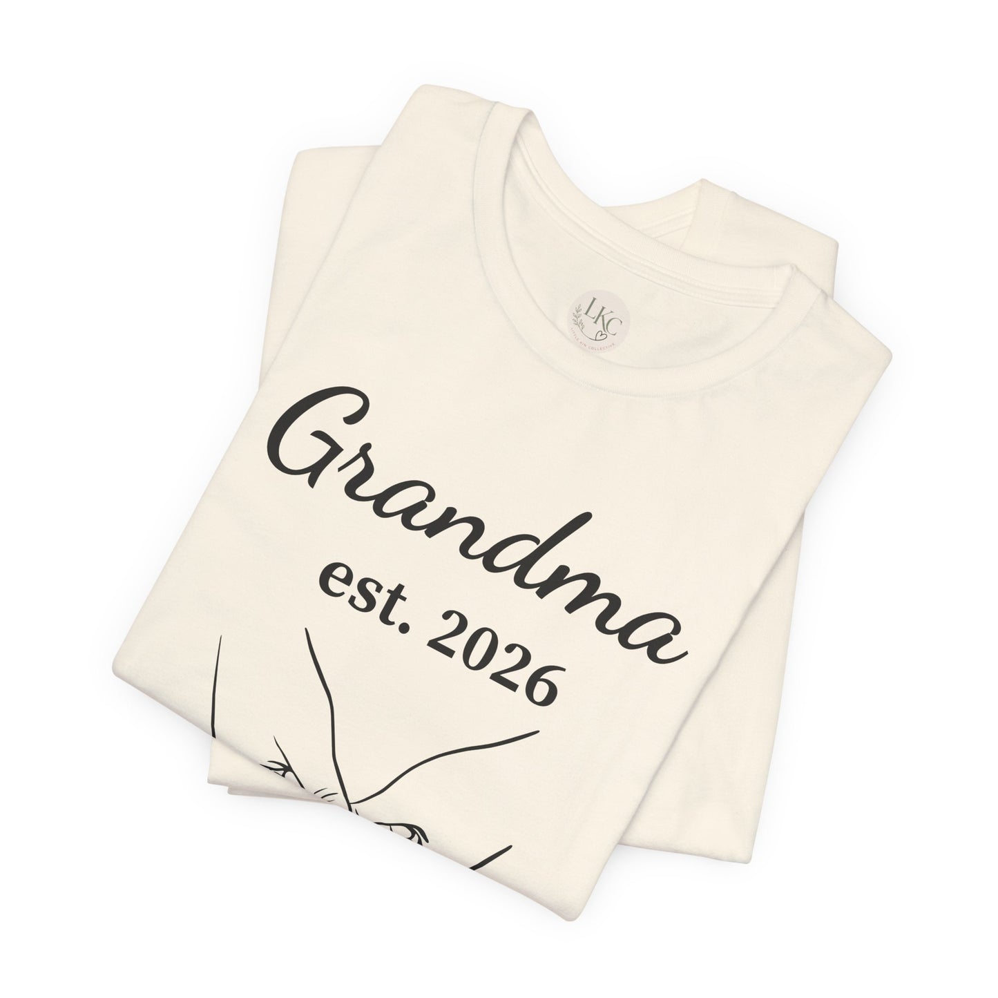 Grandma Est. 2026 T-Shirt — New Grandma Announcement Tee with Handholding Baby Illustration