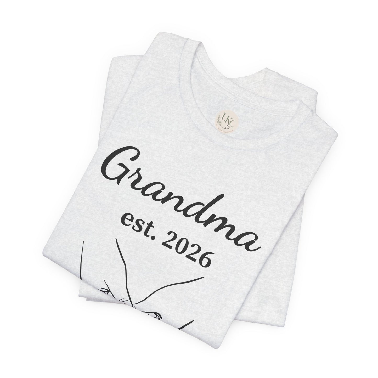 Grandma Est. 2026 T-Shirt — New Grandma Announcement Tee with Handholding Baby Illustration